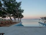 Apartments on the south side of Ciovo in the cove Mavarstica. The house is next to the sea and has a...