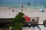 The apartment consists of a ground floor house located in the first row to the sea. From the center...