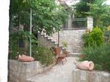 A beautiful and well-equipped apartments are located in a quiet historic core of Supetar with sea views...